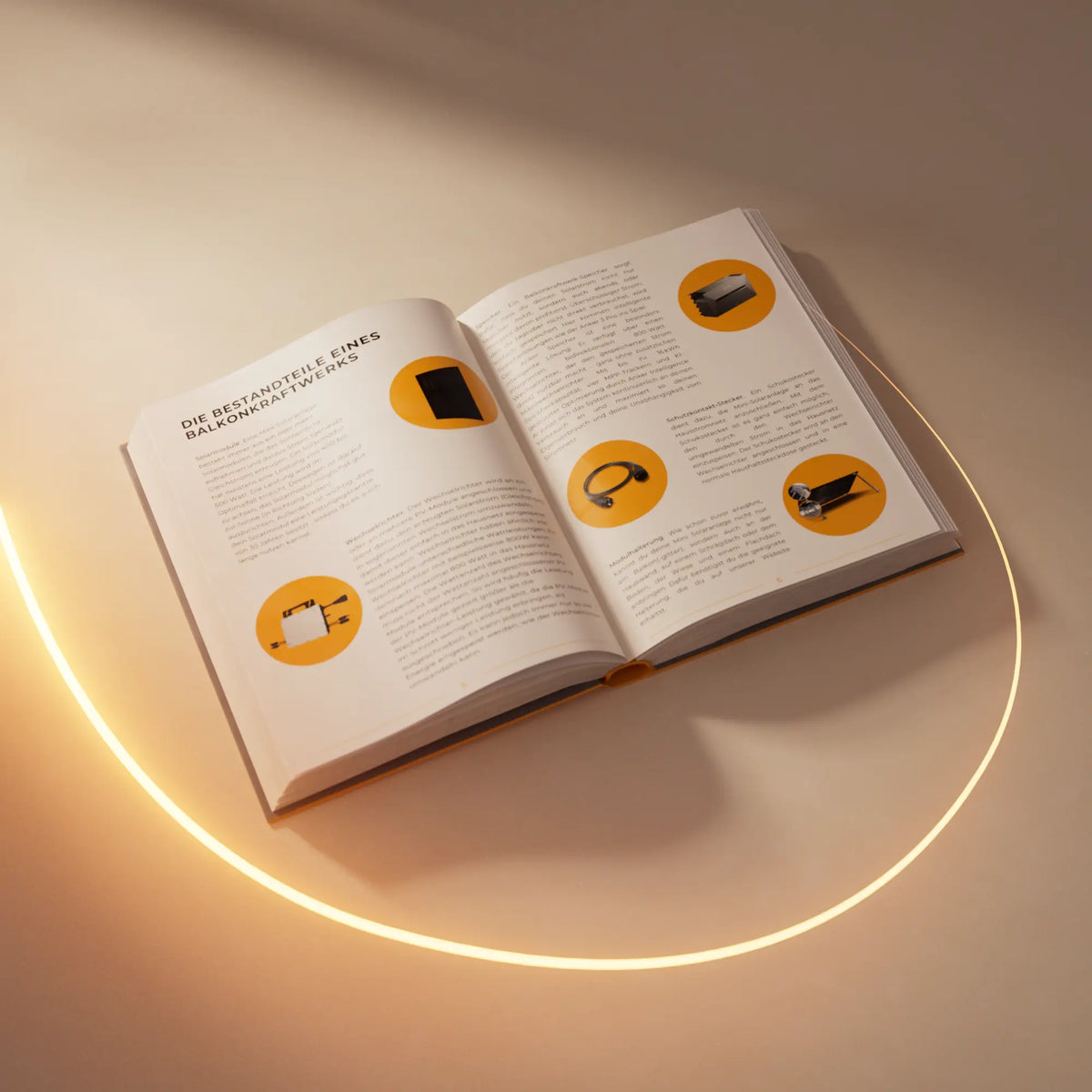 Buch "Die Bestandteile eines Balkonkraftwerks" aufgeschlagen auf dem Tisch